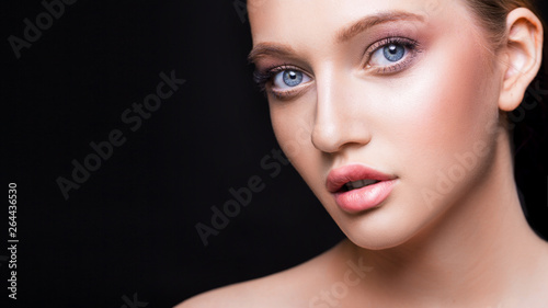 Fashion studio shot of beautiful young woman with make-up. Close-up portrait. Cosmmetology  beauty and skin care concept