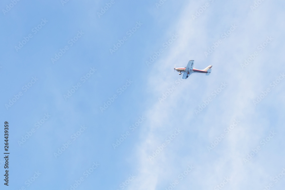 Private jet against blue sky and clouds, Puglia, Italy Private jet against blue sky and clouds, Puglia, Italy