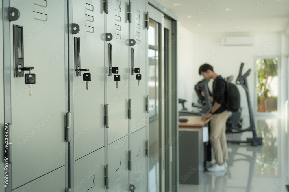 Locker room with a man is signing up for a fitness service background. Locker room with a man is signing up for a fitness service background.