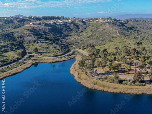 Aerial view of Miramar reservoir in the Scripps Miramar Ranch community, San Diego, California. Miramar lake, popular activities recreation site including boating, fishing, picnic & 5-mile-long trail. photo