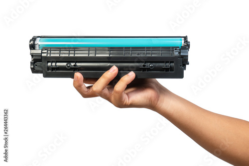 Used laser toner cartridge holding by hand of worker or user for replace, refill  with white background. Laser toner for eco and recycle concept.
