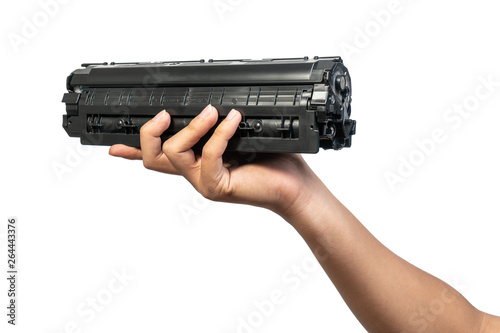 Fotografi Used laser toner cartridge holding by hand of worker or user for replace, refill  with white background