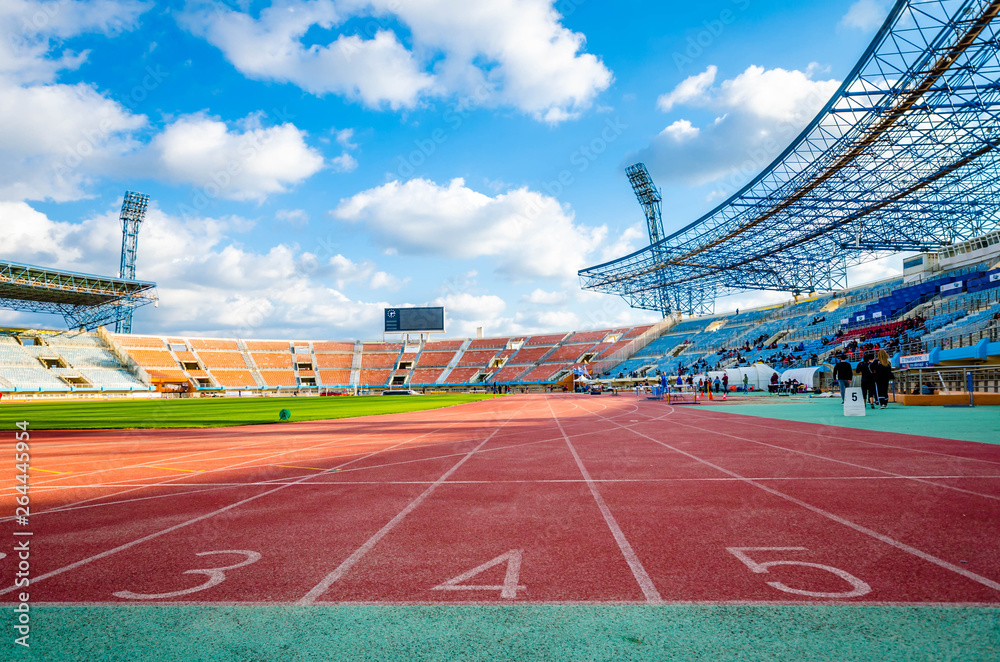© GIORGOS - Red running track with numbers in stadium. © GIORGOS - Red running track with numbers in stadium.