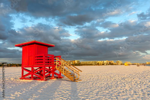 Obraz w ramie Red Lifeguard Tower Under Dramatic Sky