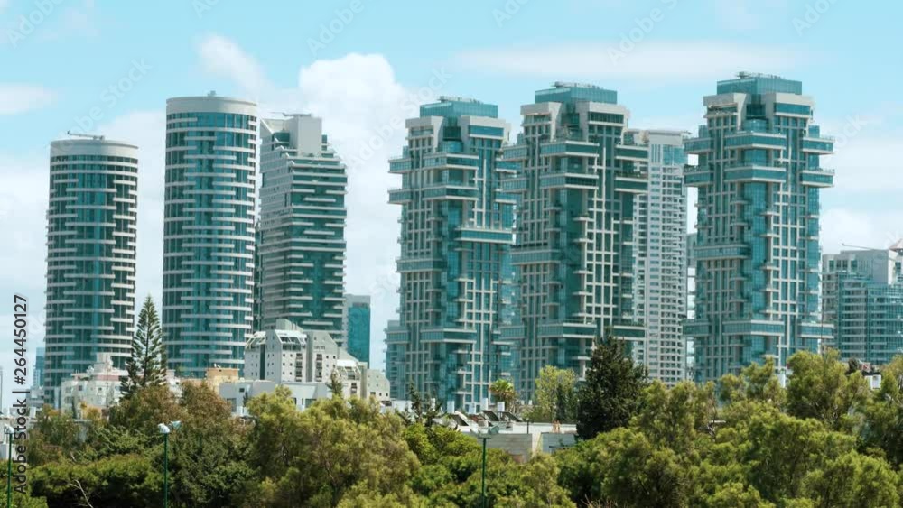 Boutique Residential Apartment Buildings with blue sky and Puffy Clouds in the background