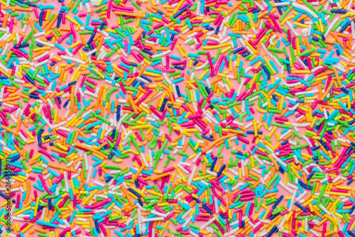 trendy pattern of colorful sprinkles like background, sweet decoration © Alisa