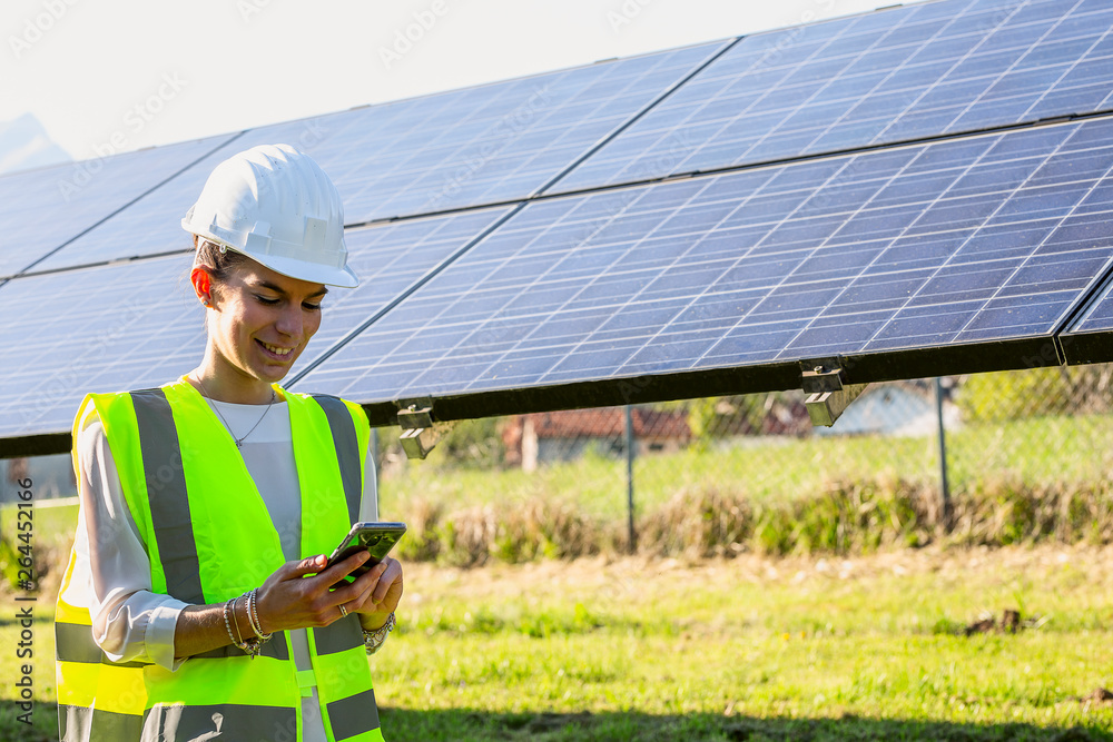 engineer in front of solar panels engineer in front of solar panels