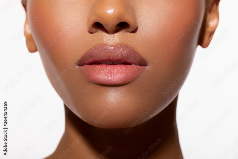Beautiful lips Close-up. Makeup. Fashionable portrait girl in neon light background. Portrait of beautiful black woman. Sexy bodily Lips close up.      - obrazy, fototapety, plakaty 