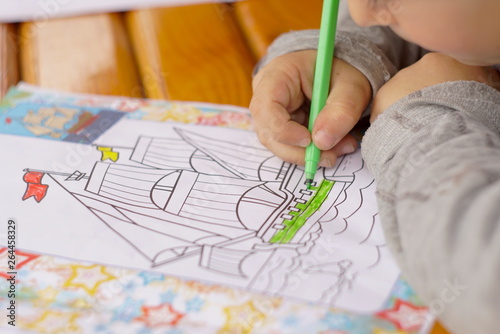 the child draws coloring close up