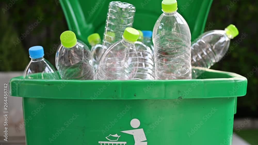 man hand putting plastic reuse for recycling concept