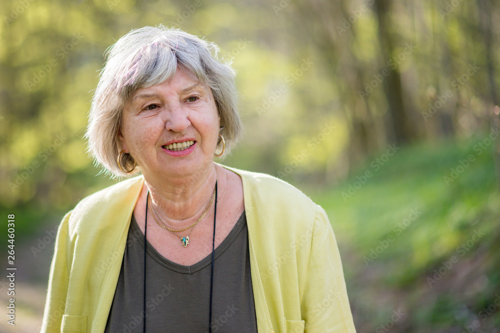 portrait of senior woman, outdoors. Cheerful, happy elderly lady. portrait of senior woman, outdoors. Cheerful, happy elderly lady.