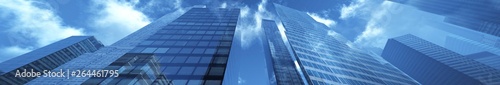 Panorama of beautiful skyscrapers against the sky with clouds. 3d rendering.