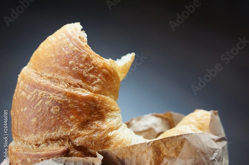 freshly baken vegan croissant in a brown paper bag