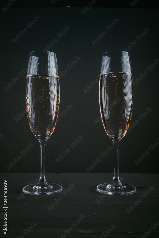 Pair of glasses of champagne on a dark background Pair of glasses of champagne on a dark background