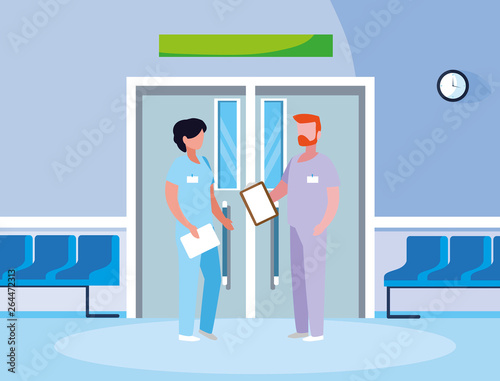 couple medicine workers in elevator door