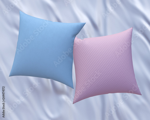 фотографія Two blank pink and blue soft square cotton pillows on white satin bedsheet, mess
