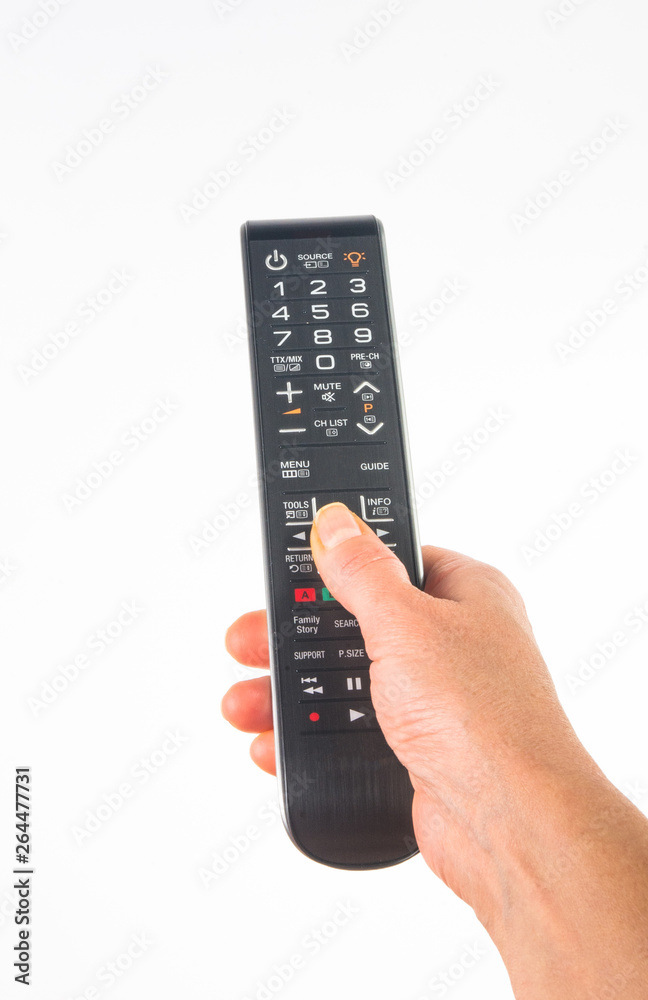 hand holding a remote control on white background, close-up hand holding a remote control on white background, close-up