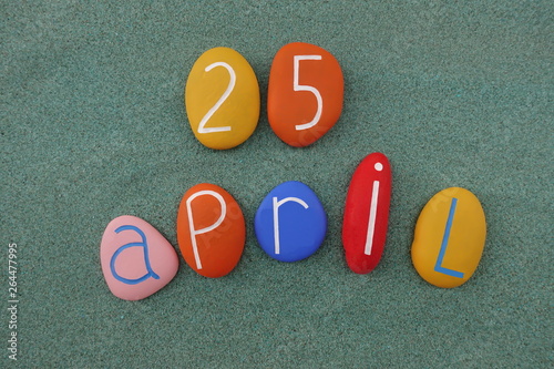 25 April, calendar date with colored stones over green sand