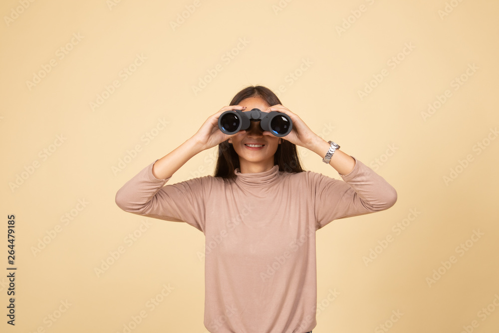 Young Asian woman with binoculars. Young Asian woman with binoculars.