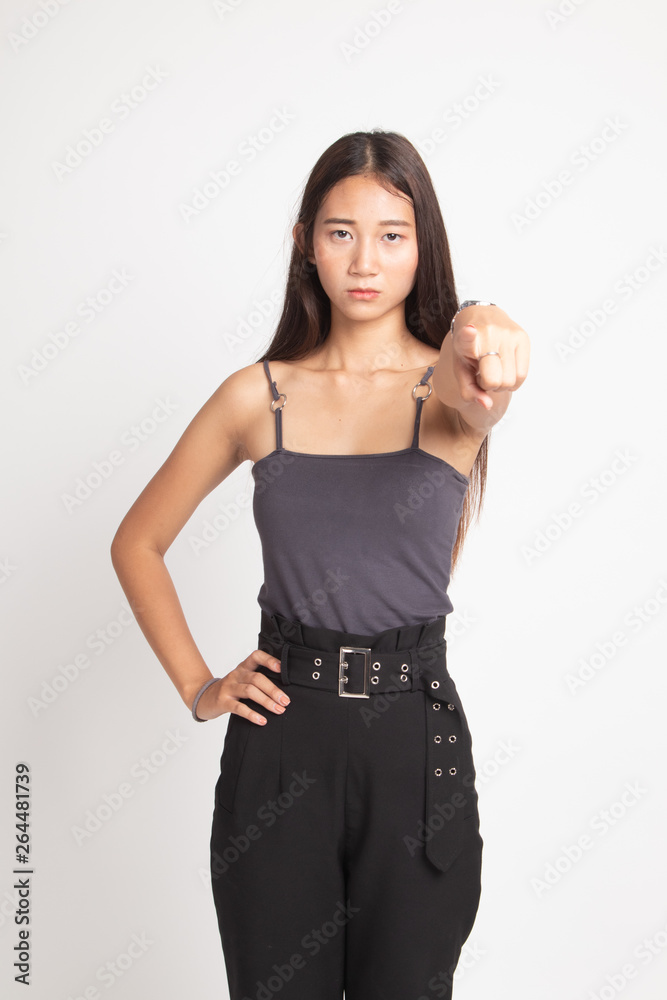 Young Asian woman angry and point to camera.