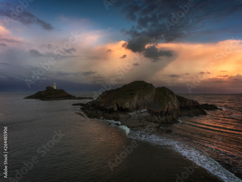 Soft clouds at dusk over Mumbles lighthouse in Swansea, South Wales, UK