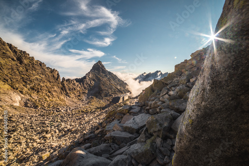 Foggy Mountains and Cottage under Rysy Mountain as Seen from Sedlo Vaha, High Tatras, Slovakia photo