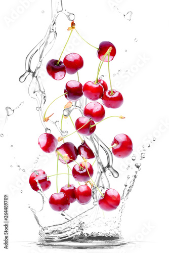 splash of water and cherries isolated on white background