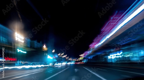 Fast car trip time lapse on the highway by night seen from the car