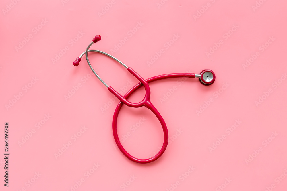 diagnostic and cure of cardiac disease with stethoscope on pink background top view diagnostic and cure of cardiac disease with stethoscope on pink background top view