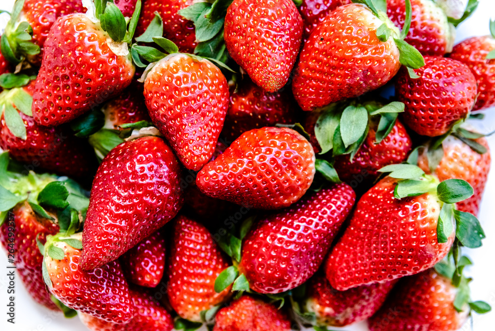 Mediterranean red strawberries shining in a kitchen. Mediterranean red strawberries shining in a kitchen.