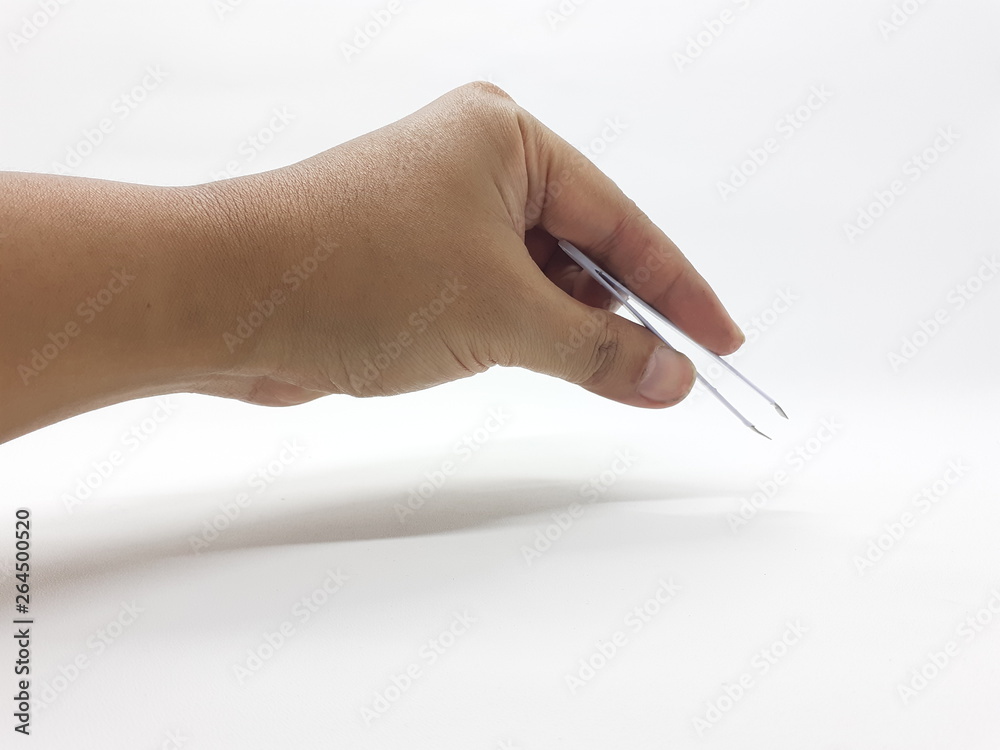 Human hand holding tweezers in white isolated background Human hand holding tweezers in white isolated background