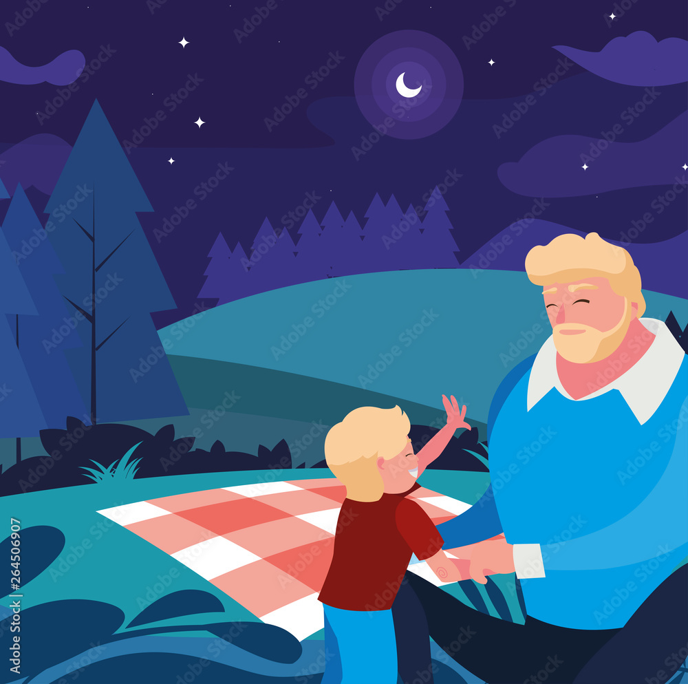 father with son in the field picnic day