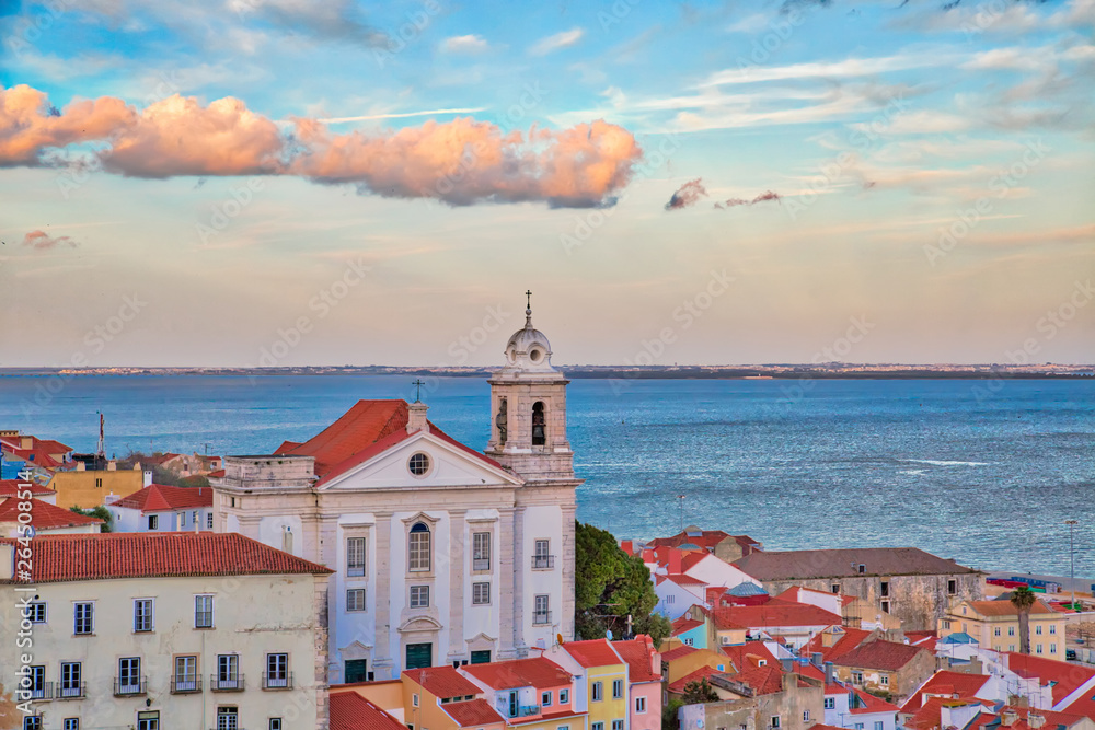 Scenic Alfama lookout with San Vicente (Saint Vincent) statue and Sao Vicente de Fora a church on the background