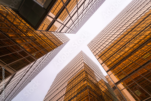 Low angle view of gold modern skyscraper business buildings