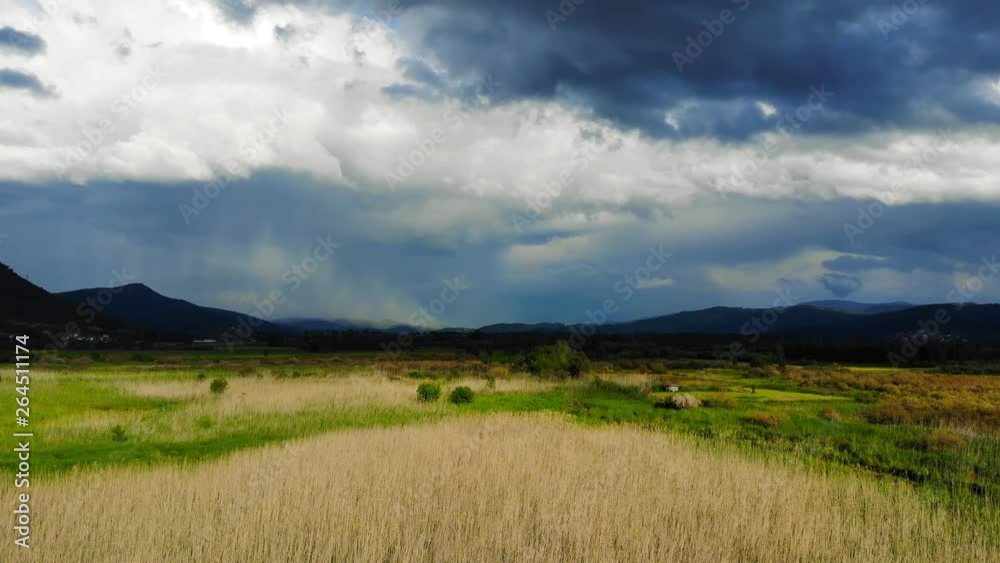 An aerial shot from the Aegean coastal marshlands. Taken in Akyaka (Gulf of Gokova, Aegean Sea) on a colorful spring afternoon just before a storm. An aerial shot from the Aegean coastal marshlands. Taken in Akyaka (Gulf of Gokova, Aegean Sea) on a colorful spring afternoon just before a storm.