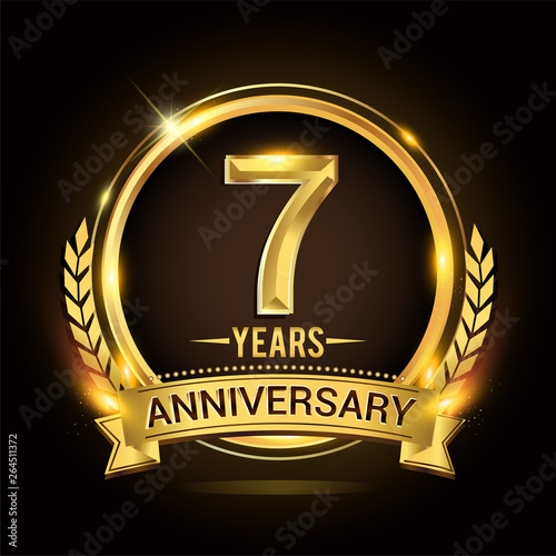 Celebrating 7th years anniversary logo with golden ring and ribbon, laurel wreath vector design.