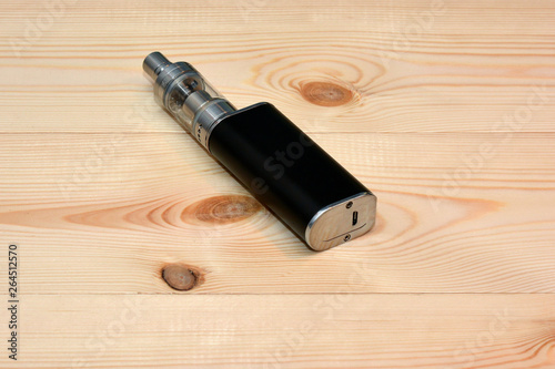E - cigarette for vaping , technical devices.The liquid in the bottle 