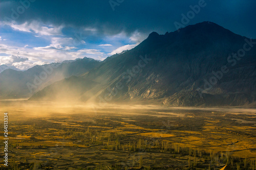 Beautiful landscape at sunset from Diskit Monastery. Diskit Monastery also known as Deskit Gompa or Diskit Gompa is the oldest and largest Buddhist monastery in the Nubra Valley of Ladakh, India. photo