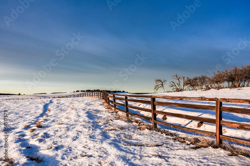 winter landscape with wooden fencing 
