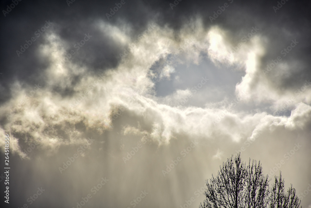 ring of sunlight breaking through storm clouds ring of sunlight breaking through storm clouds