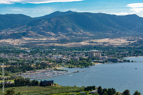 Magnificent view over Okanagan lake and valley with high clouds in the sky photo