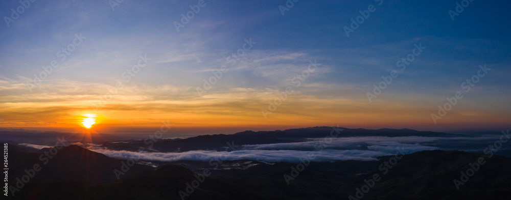 panoramic landscape the sunlight with blue sky background on the mountain at morning mist