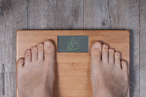 Good weight – thumb up gesture on weight scale