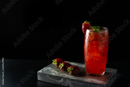 Brazilian Strawberry Caipirinha is on the bar. Space for text. Photo for the menu.