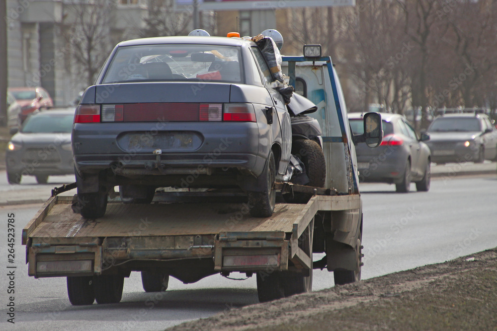 tow truck, takes away the damaged car after an accident