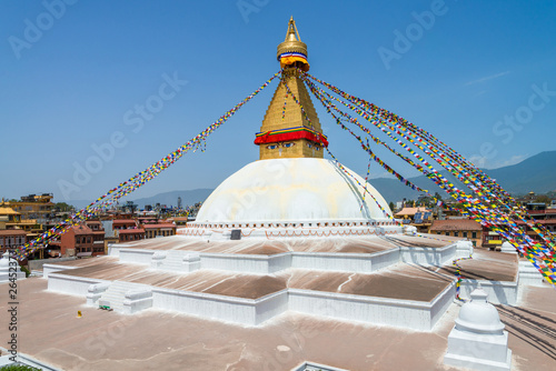 The Buddhist stupa of Boudha Stupa dominates the skyline. It is one of the largest unique structures stupas in the world Located in kathmandu, Nepal.