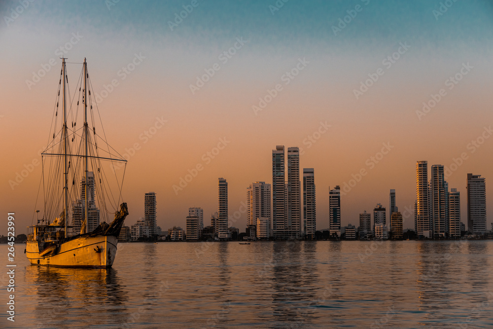 Ship and cityscape at sunrise in Cartagena