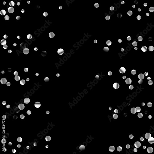 Silver confetti on a black background.