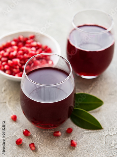 Pomegranate juice with fresh pomegranate fruits