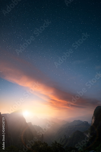 Vertical image of majectic landscape at sunset with stars on the sky